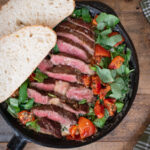 Grilled steak with creamed kale and dried tomato
