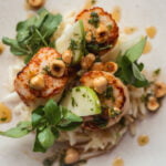 Seared scallops with a celeriac and apple salad, watercress, hazelnut and brown butter vinaigrette